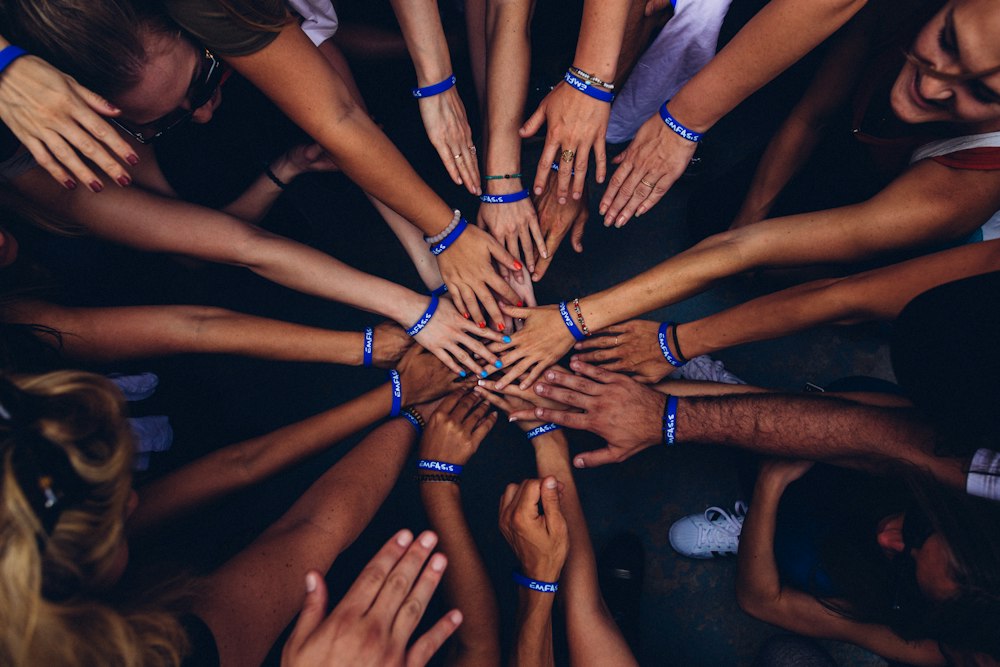 Hands joined together in a circle